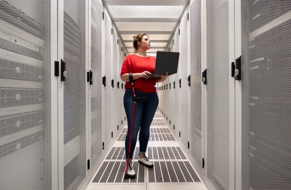 Professional studying cloud computing online with servers and cloud icons in the background